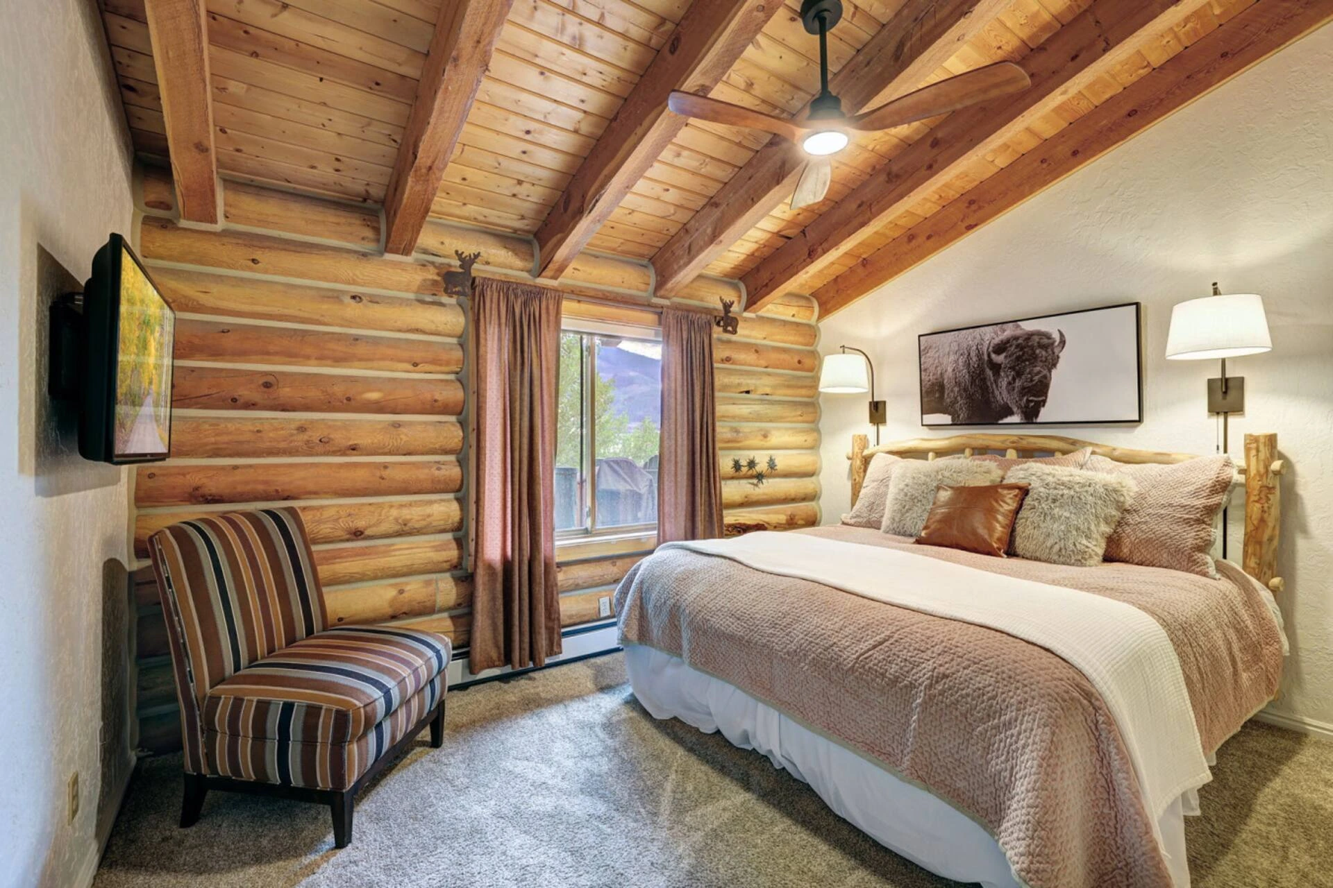 Prepared king bedroom at Lincoln Lodge with crisp bedding and exposed timber beams