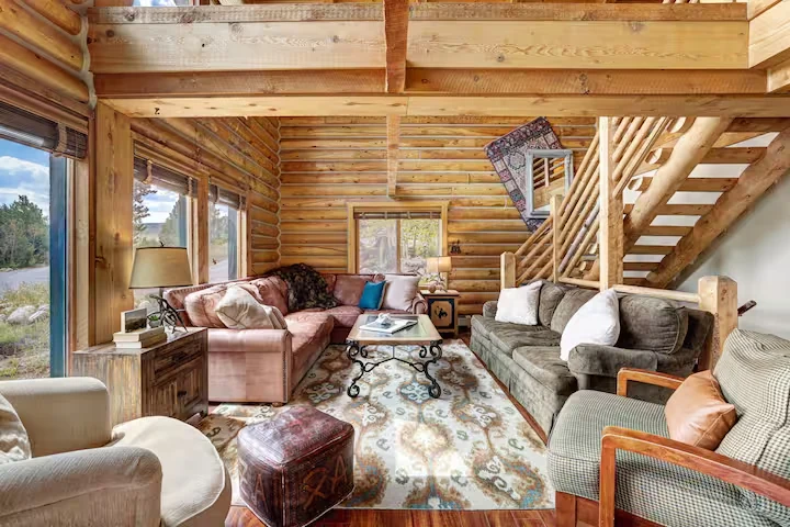 Main living room at Lincoln Lodge filled with timber and mountain light