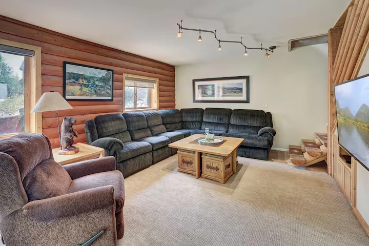 Media lounge with sectional sofa and television at Lincoln Lodge