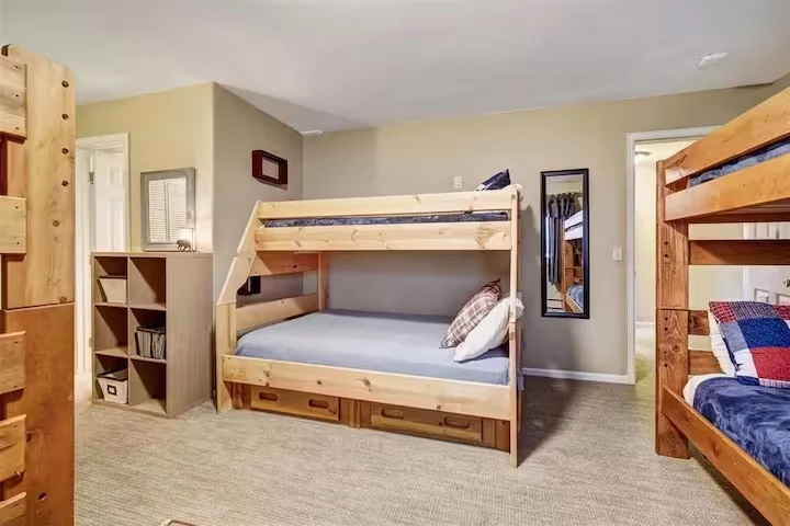 Second view of the Lincoln Lodge bunk room with three bunk beds
